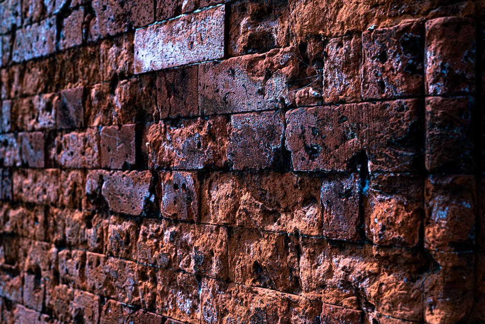 Spalling red bricks arranged in a wall, Chiswick, London, Nikon D750 50mm f8