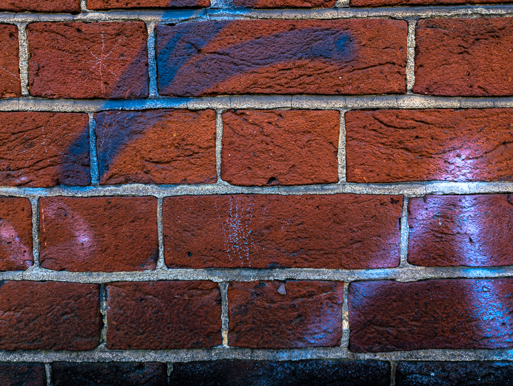 Paint adhered to red brick wall, Camberwell, google pixel 7 pro